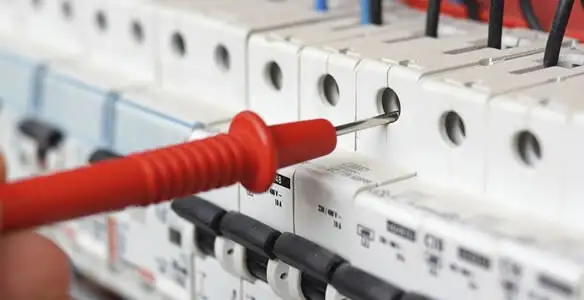 Electrical contractor testing circuit breakers during electrical repair in Seattle, WA