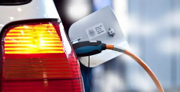 Electric car plugged into EV charger after professional installation in Bellevue, WA