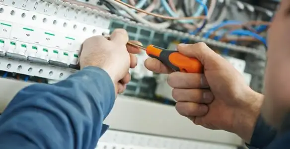 electrical service showing licensed electrician performing electrical panel maintenance and adjustments in Bellevue, WA