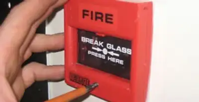 fire alarm installation service showing manual fire alarm pull station installed by licensed electricians in Bellevue, WA