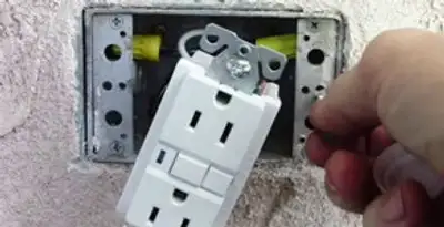 gfci circuits service showing installation of a ground fault circuit interrupter outlet by licensed electricians in Bellevue, WA