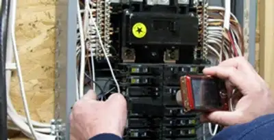 Home electrical inspection of circuit breaker panel by licensed electrician in Bellevue, WA