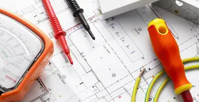 licensed electrician planning and testing electrical systems using professional tools in Bellevue, WA