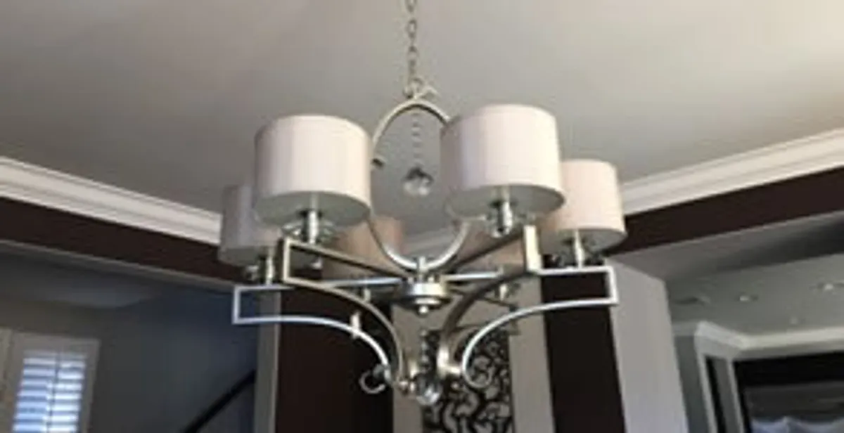 Modern chandelier installation with multiple light fixtures in Bellevue, WA