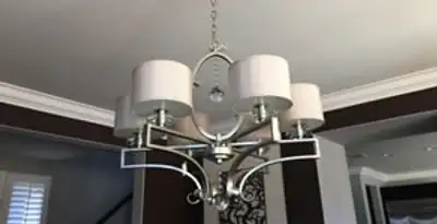 Modern chandelier installation with multiple light fixtures in Bellevue, WA