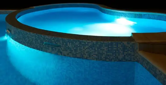 pool light installation and repair services highlighting illuminated pool interior lighting in Bellevue, WA