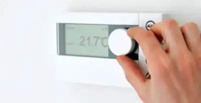 Thermostat installation service with professional adjusting temperature control in Bellevue, WA