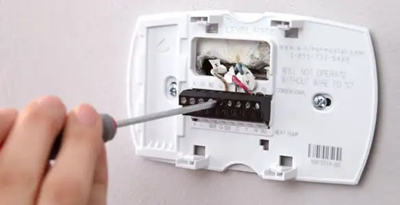 Thermostat installation service with proper wiring and secure wall mounting in Bellevue, WA