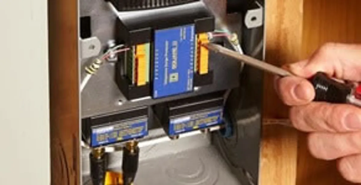 Whole home surge protection device being installed by a licensed electrician to protect electrical systems in Bellevue, WA